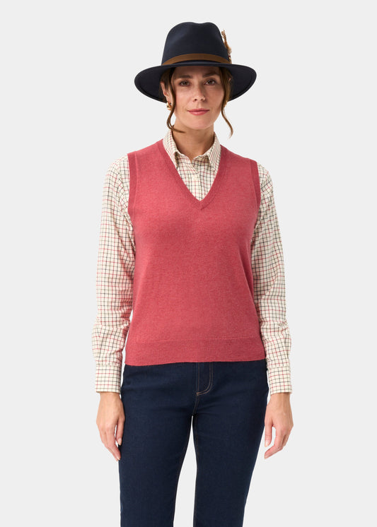 Woman in an Erin Wool & Cashmere V-Neck Slipover in Rouge stands against a light background.
