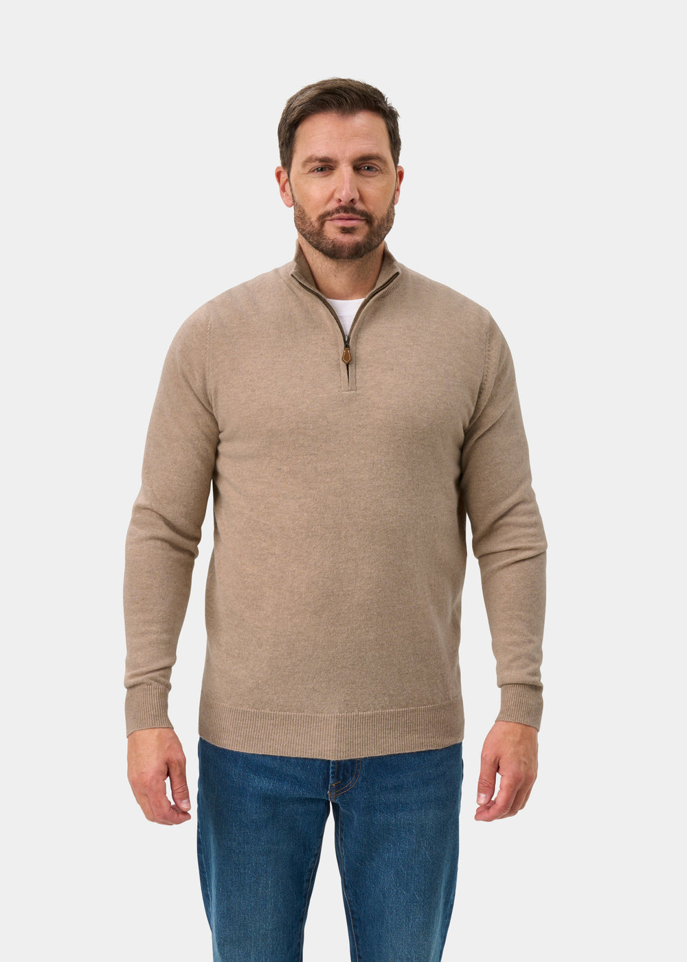 Man wears Hanbury Pure Cashmere Quarter Zip Jumper in Linen, regular fit, with blue jeans against a white background.