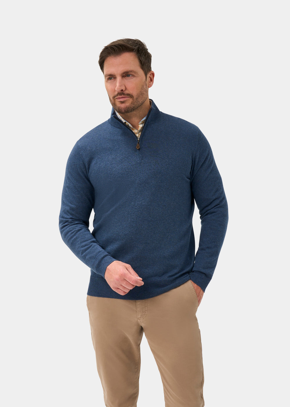 Man in Ashfield Cotton Merino Quarter Zip Jumper in Denim, regular fit, with khaki pants, on light background.