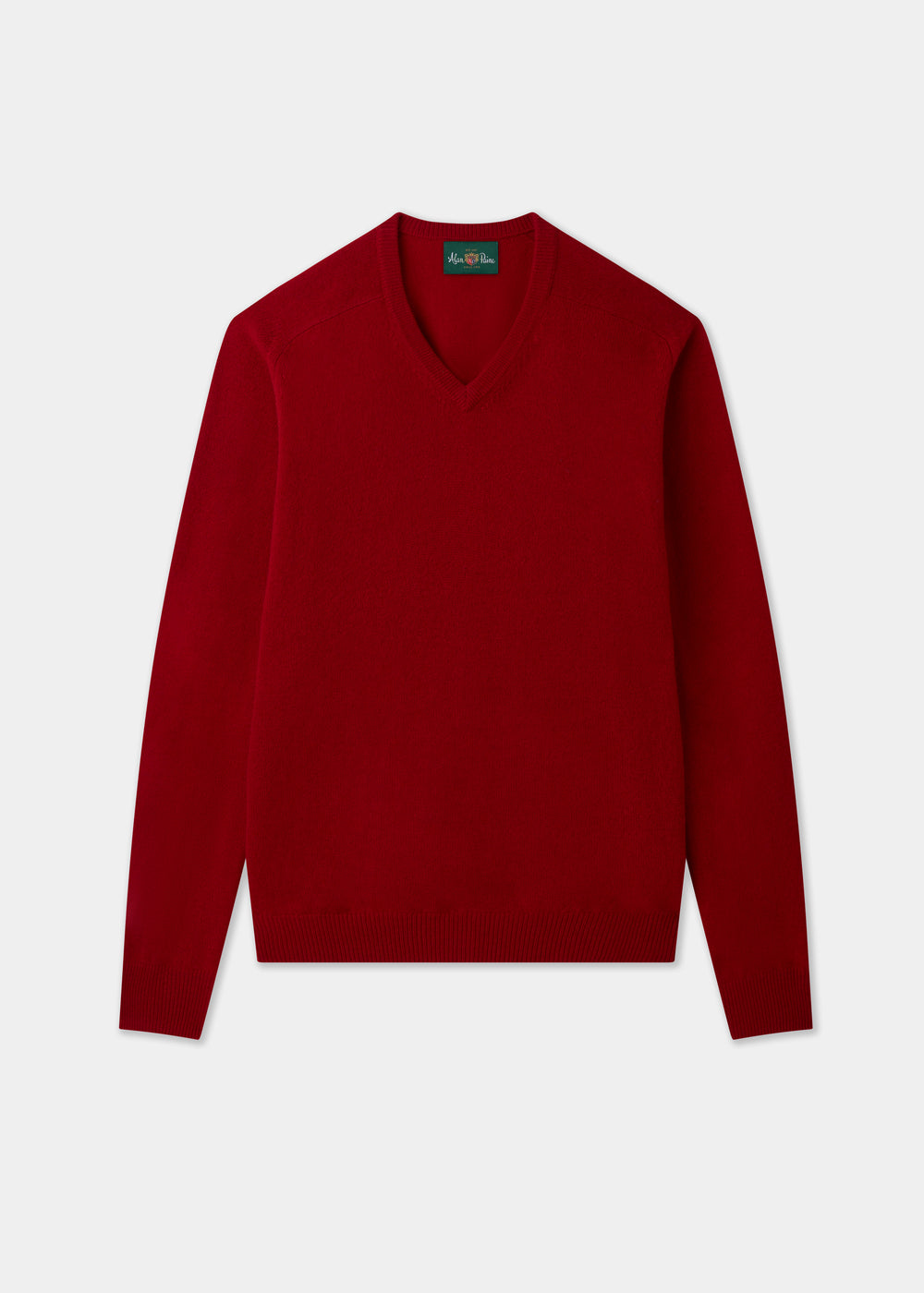 Hampshire Lambswool Vee Neck Jumper in Dubonnet, classic fit, red, long sleeves; laid flat on white background.