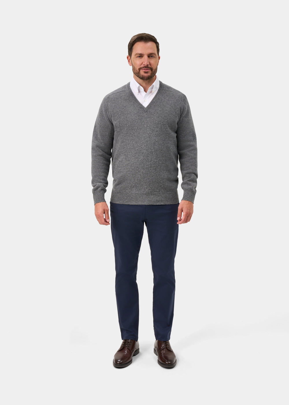 Man models the Hampshire Lambswool V-Neck Jumper in Grey Mix—Classic Fit against a plain white background.