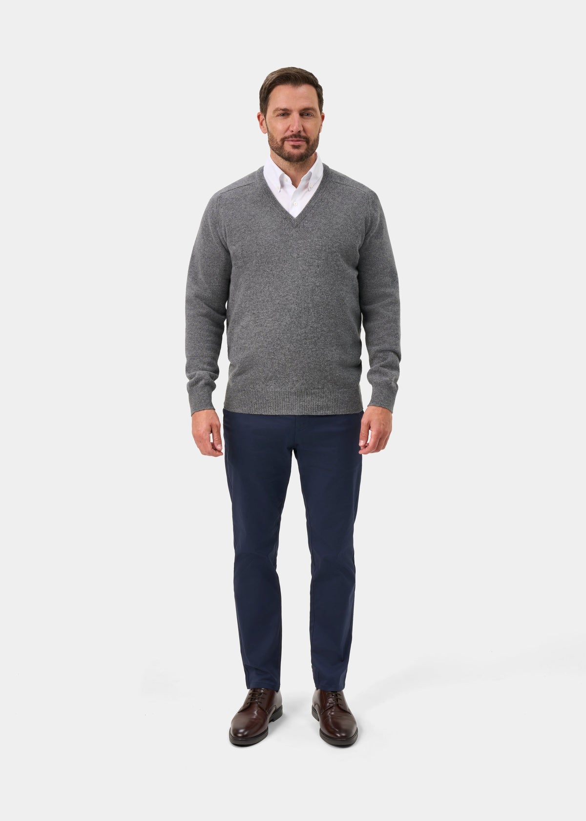 Man models the Hampshire Lambswool V-Neck Jumper in Grey Mix—Classic Fit against a plain white background.