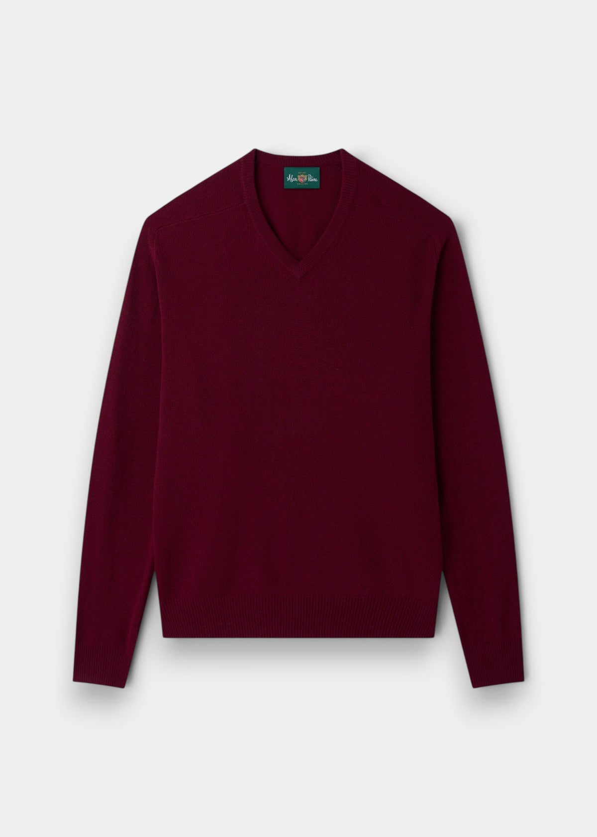 A Hampshire Lambswool V-Neck Jumper in Bordeaux, classic fit, is laid flat on a white background.