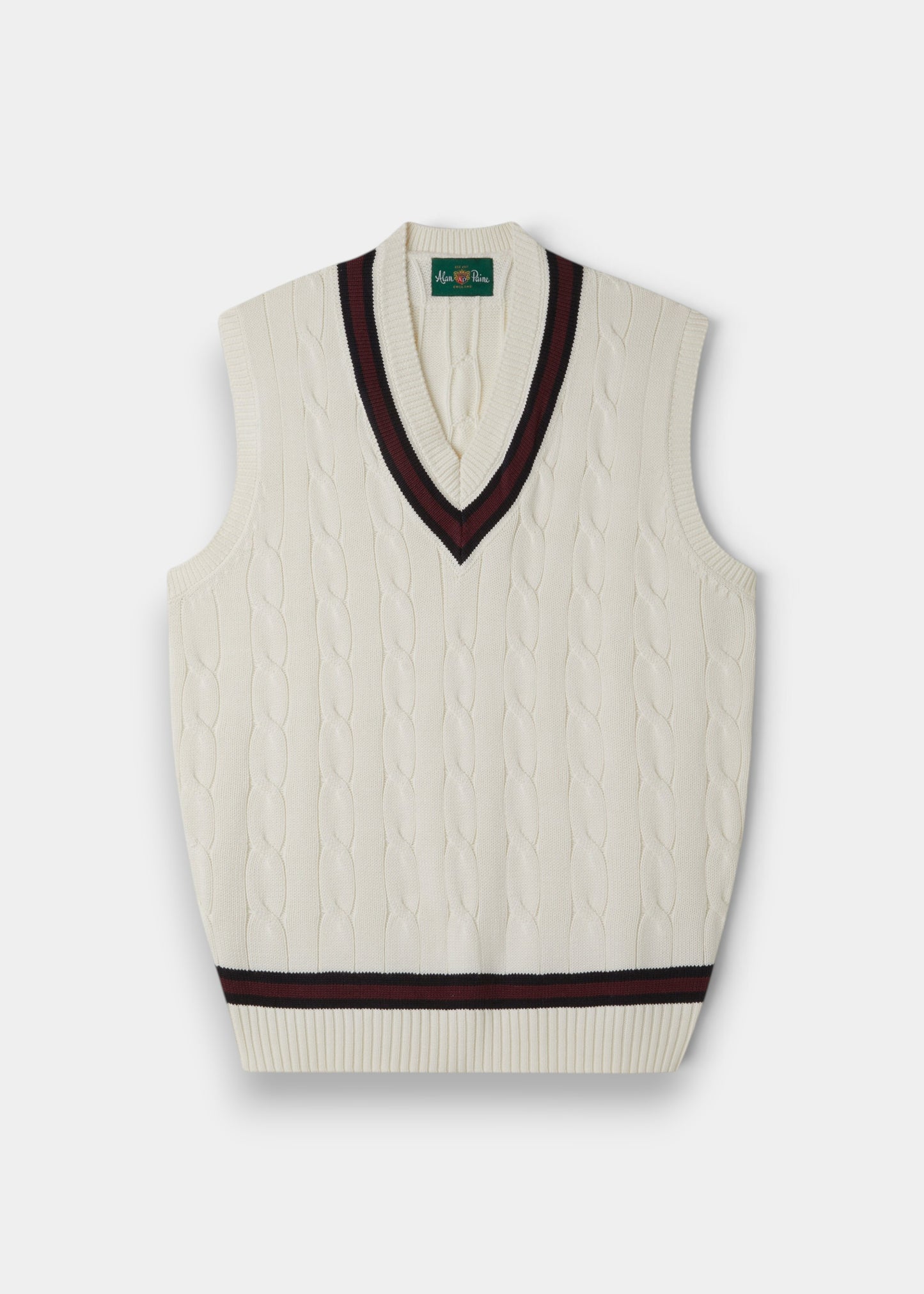 Alan Paine ecru cotton cable knit cricket slipover with dark navy and burgundy V-neck and hem trim.
