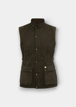 Felwell Men’s Waistcoat in olive with snap buttons, stand-up collar, flap pockets, and gold emblem on the pocket.