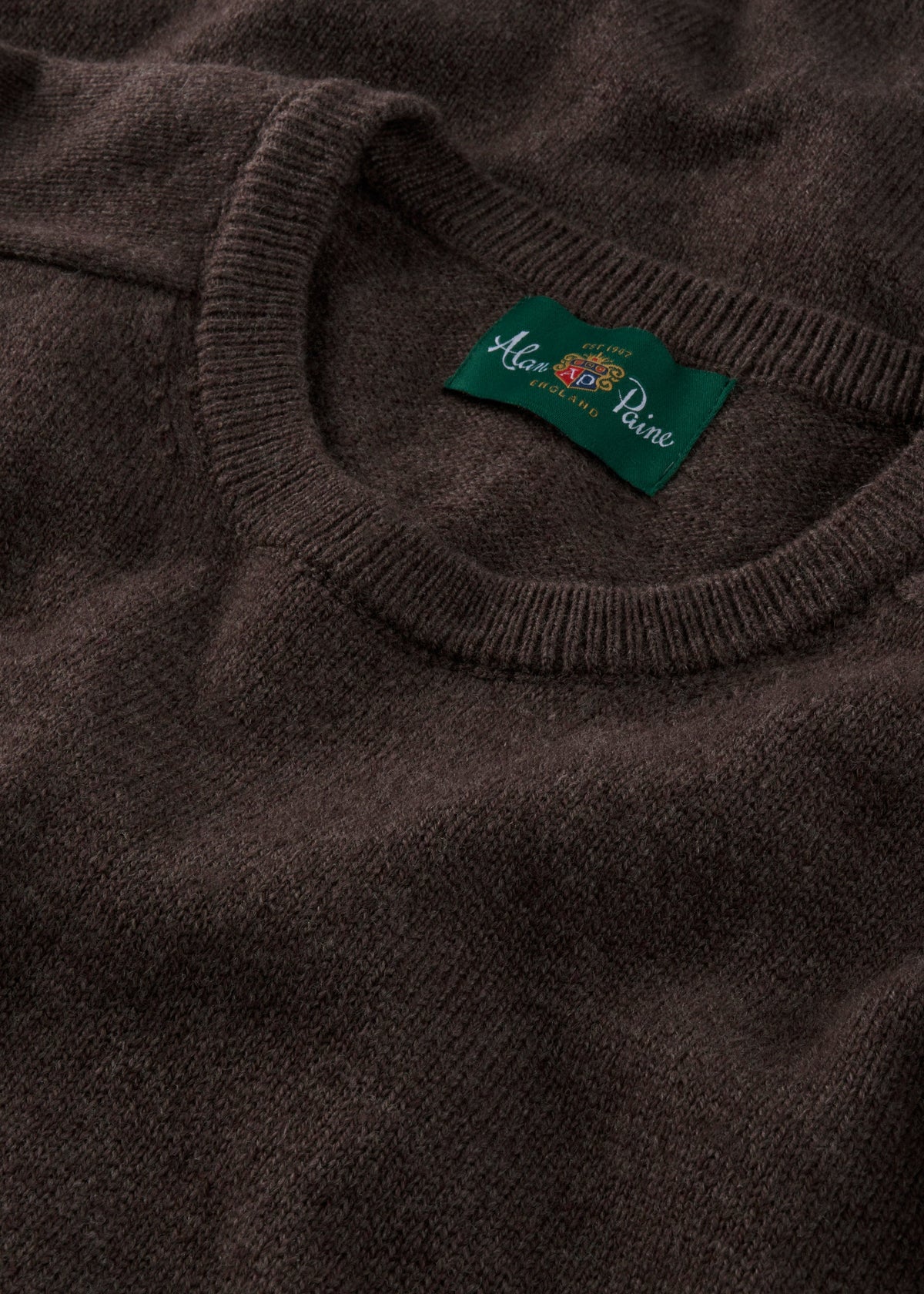 Mocha Dorset Lambswool Crew Neck Jumper—Classic Fit. Features green Alan Paine label, ideal for countryside style.