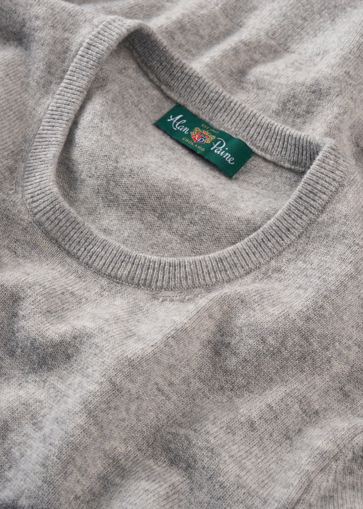 Ivy Wool & Cashmere Crew Neck Jumper in Husky with green Alan Paine label at neckline, shown lying flat.