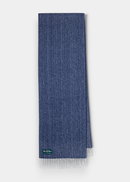 Kinross Cashmere Herringbone Scarf in Indigo with white fringe, subtle pattern, and green logo tag on one corner.